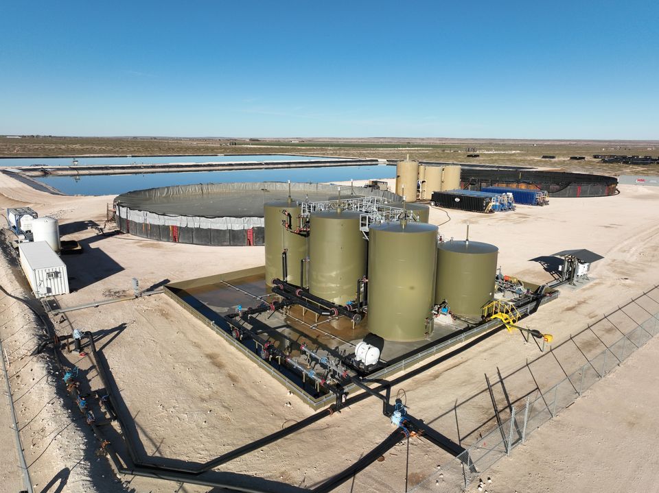 Drone view of a tank battery and lined storage at a produced water facility